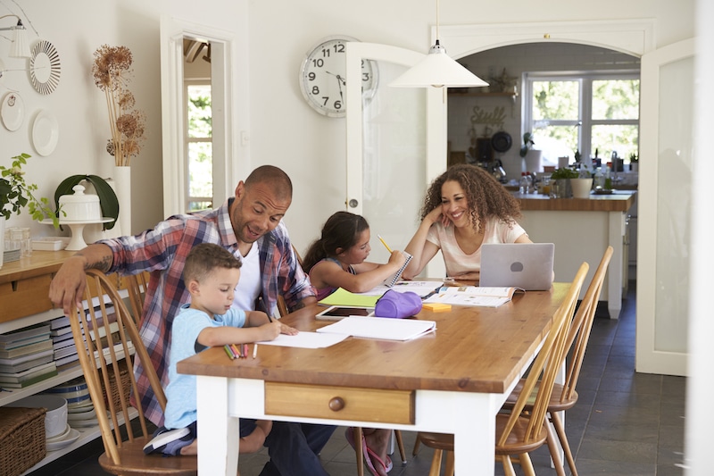 Be Proactive With Your Heating and Air Conditioning, Not Reactive. Family in kitchen.